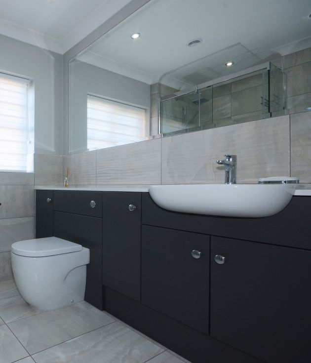 Ensuite Bathroom in Marble and blue slab units designed and installed by Leger Interiors in York