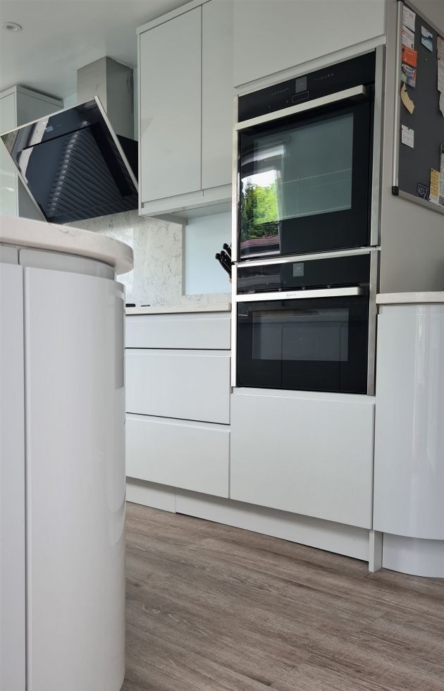 High gloss white gallery Kitchen designed and installed by Leger Interiors in York